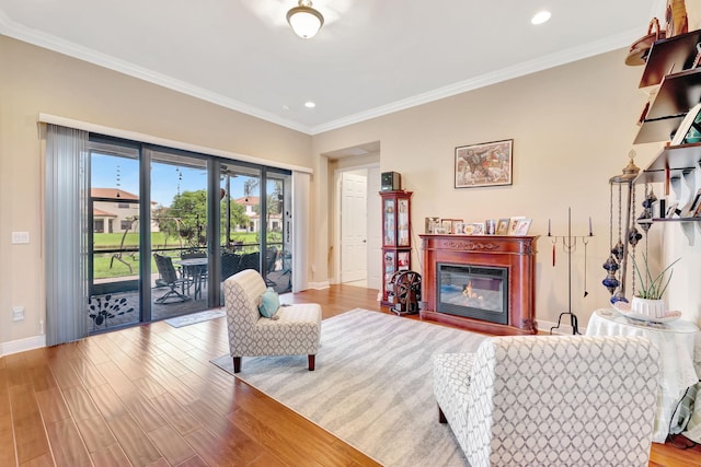 living room with ornamental molding and light wood-type flooring