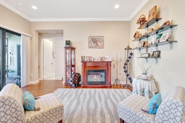 living room with crown molding and light hardwood / wood-style flooring