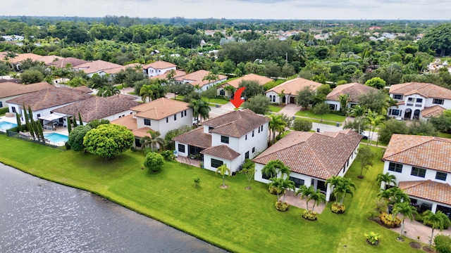 drone / aerial view with a water view