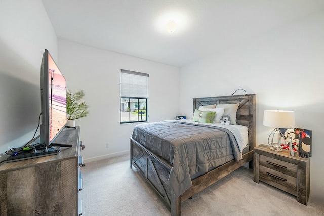 bedroom with light colored carpet