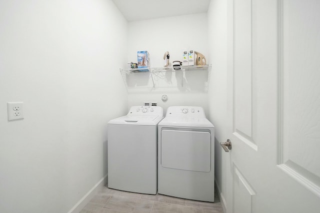 washroom featuring washer and clothes dryer