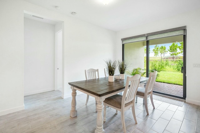 dining space featuring light hardwood / wood-style flooring