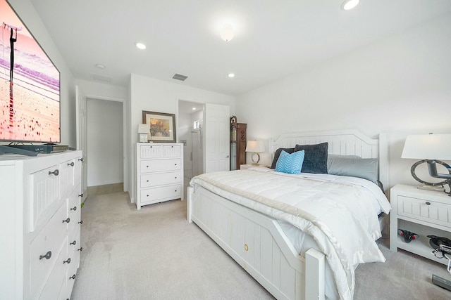 bedroom featuring light colored carpet