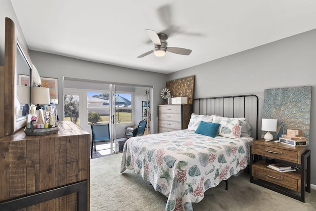 bedroom featuring ceiling fan and light carpet