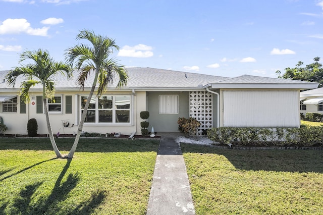 single story home with a front yard