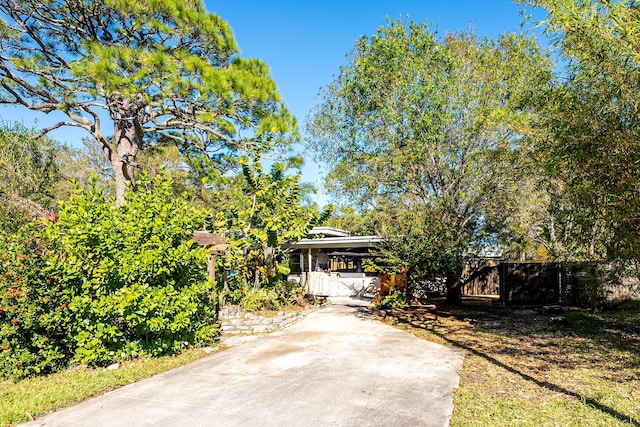 view of property hidden behind natural elements