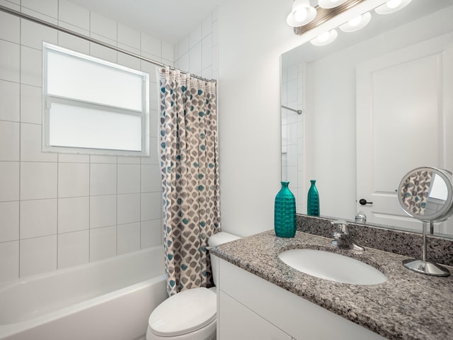 full bathroom with vanity, toilet, and shower / tub combo with curtain