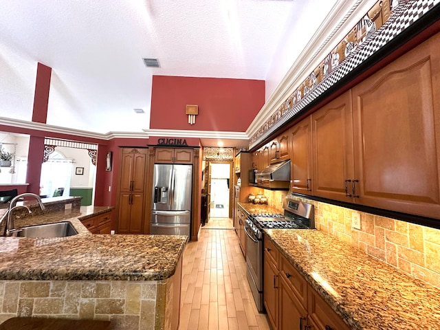 kitchen with tasteful backsplash, crown molding, sink, and appliances with stainless steel finishes