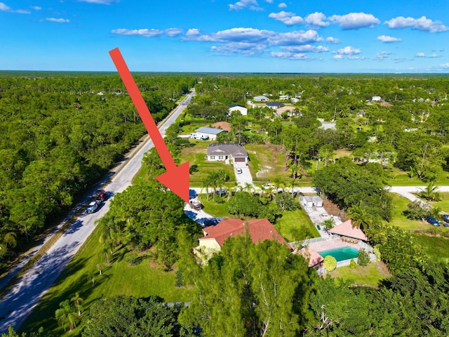 17976 88th Rd N, Loxahatchee, FL 33470 - aerial overview of property's location featuring a heavily wooded area and nearby suburban area