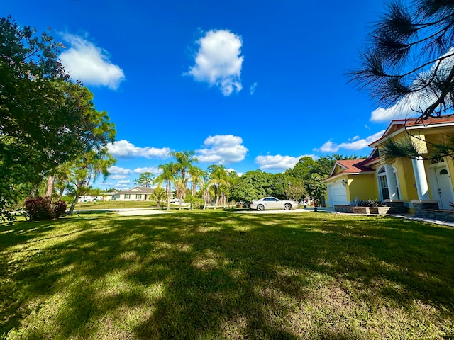 view of yard featuring a garage