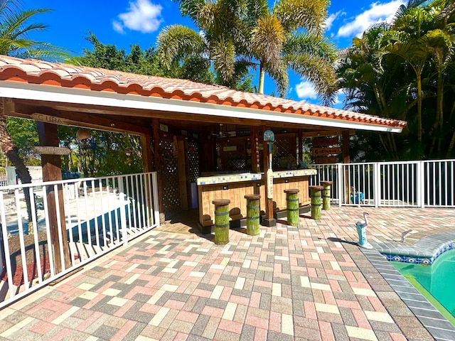 view of patio featuring a gazebo and an outdoor bar