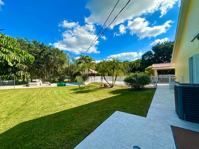 view of yard featuring central AC