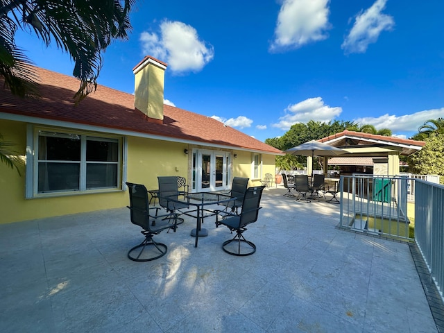 17976 88th Rd N, Loxahatchee, FL 33470 - view of patio with outdoor dining area and french doors