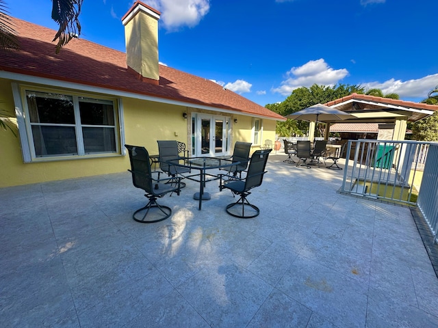 17976 88th Rd N, Loxahatchee, FL 33470 - view of patio with outdoor dining area and french doors