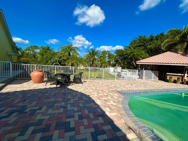 view of patio featuring a fenced in pool