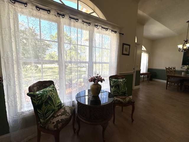 17976 88th Rd N, Loxahatchee, FL 33470 - dining space featuring a chandelier, wood finished floors, and baseboards