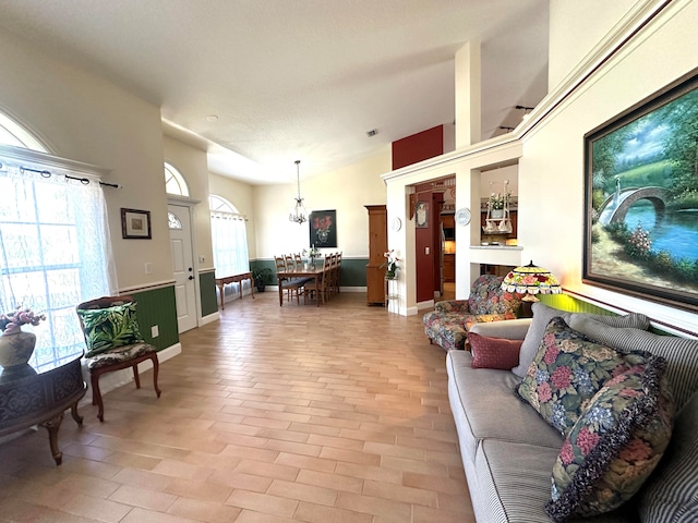 living room with a chandelier and a textured ceiling