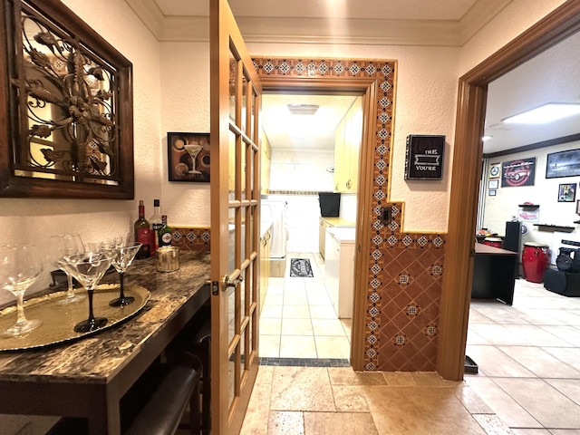 17976 88th Rd N, Loxahatchee, FL 33470 - corridor with crown molding, a textured wall, and separate washer and dryer