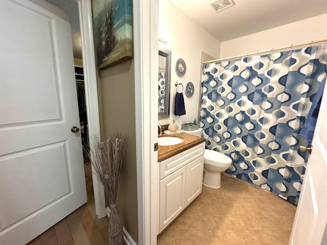 17976 88th Rd N, Loxahatchee, FL 33470 - full bathroom with vanity, toilet, tile patterned floors, and curtained shower