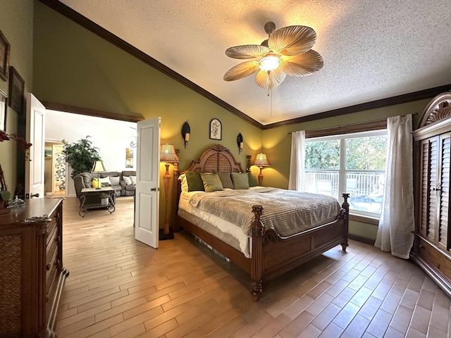 17976 88th Rd N, Loxahatchee, FL 33470 - bedroom featuring lofted ceiling, a textured ceiling, ornamental molding, light wood-style floors, and ceiling fan