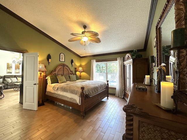 17976 88th Rd N, Loxahatchee, FL 33470 - bedroom featuring vaulted ceiling, a textured ceiling, crown molding, wood finished floors, and ceiling fan