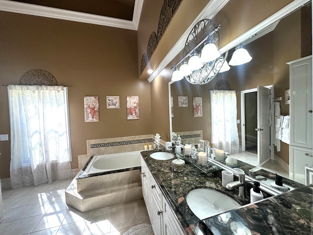 bathroom with vanity, crown molding, tile patterned flooring, tiled tub, and a notable chandelier