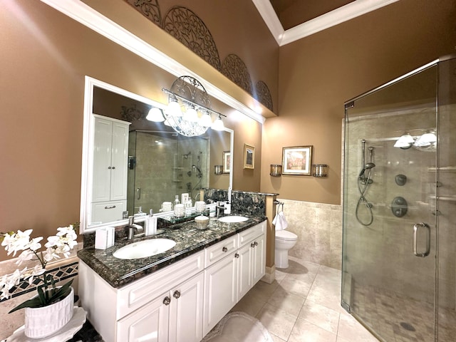 bathroom featuring walk in shower, ornamental molding, vanity, tile walls, and tile patterned flooring