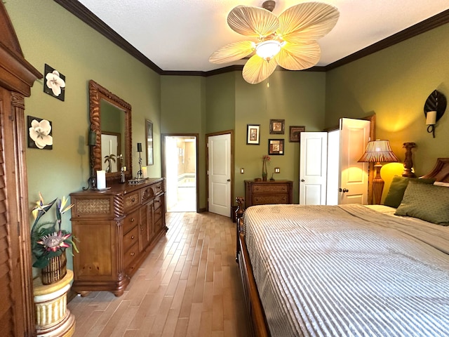 bedroom with ceiling fan, ornamental molding, and light hardwood / wood-style flooring