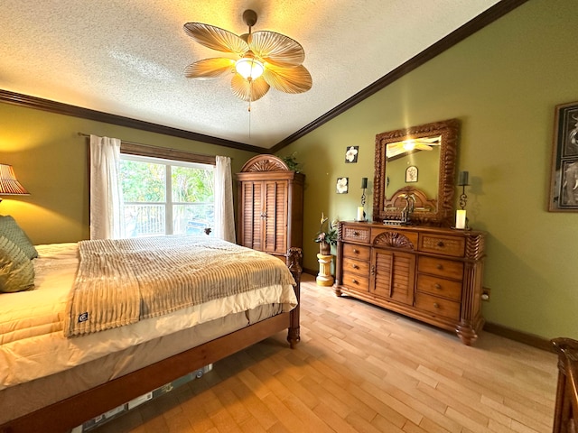 bedroom featuring a textured ceiling, vaulted ceiling, ceiling fan, crown molding, and light hardwood / wood-style flooring