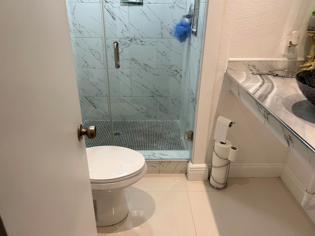 bathroom with toilet, tile patterned floors, and walk in shower