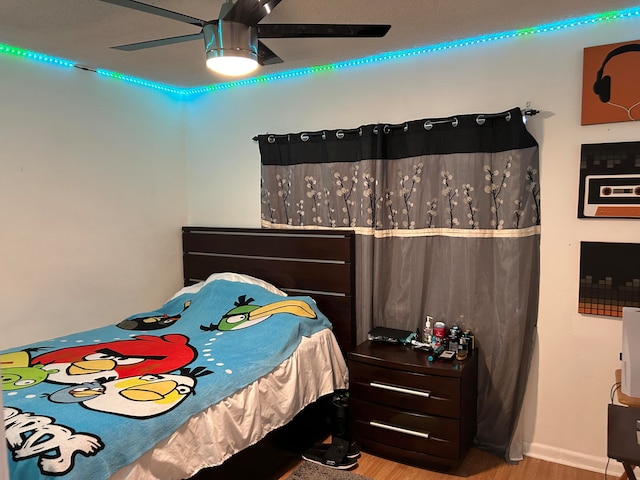 bedroom featuring ceiling fan and light wood-type flooring