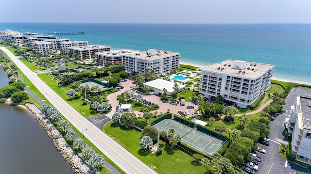 birds eye view of property with a water view