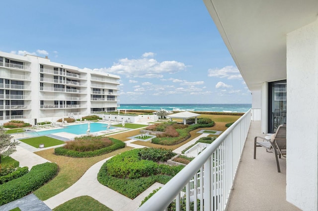 balcony featuring a water view