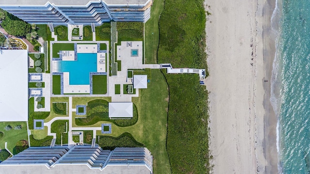 aerial view with a water view and a view of the beach