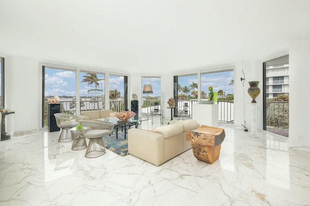 living room with a wall of windows and a wealth of natural light