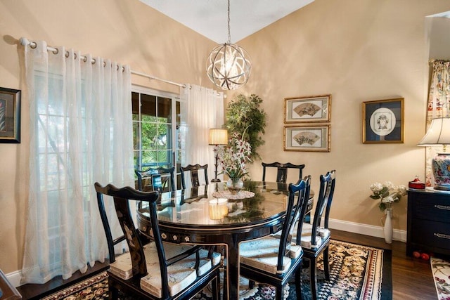 dining room featuring dark hardwood / wood-style floors and an inviting chandelier