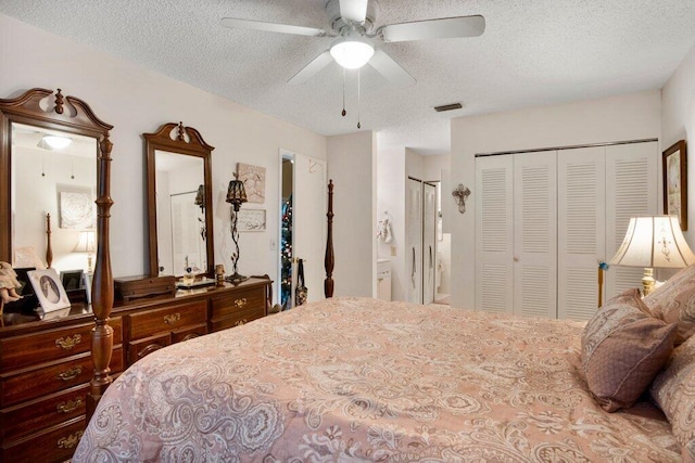 bedroom with a textured ceiling and ceiling fan