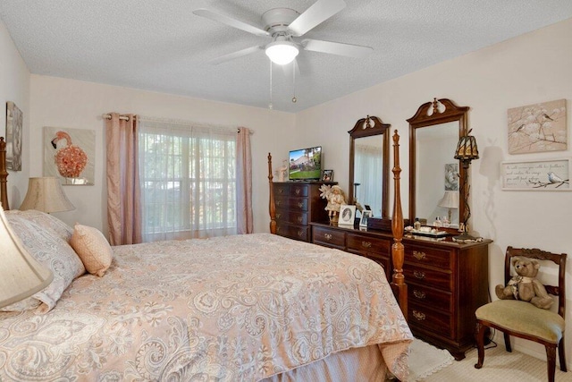 bedroom featuring a textured ceiling and ceiling fan