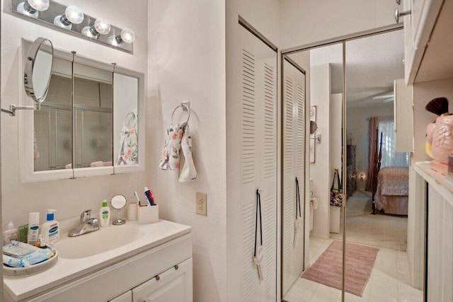 bathroom with vanity and tile patterned floors