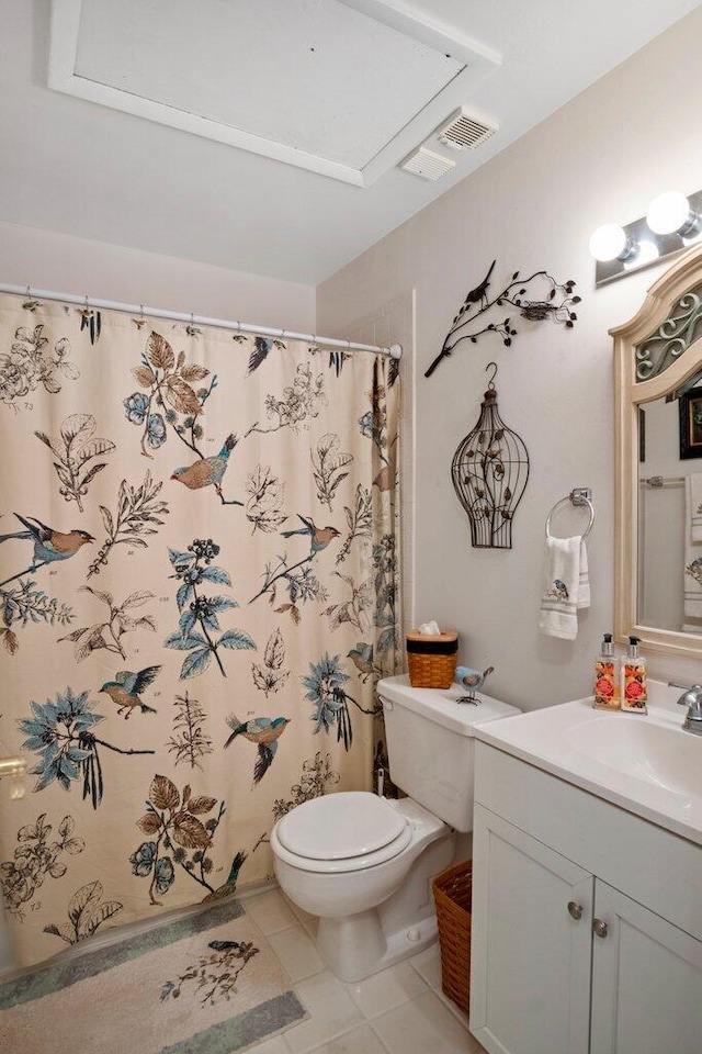 bathroom with a shower with curtain, tile patterned flooring, vanity, and toilet