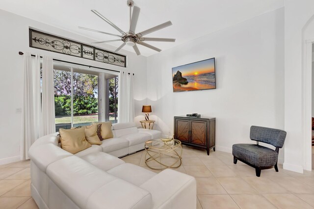 living room featuring ceiling fan and light tile patterned floors