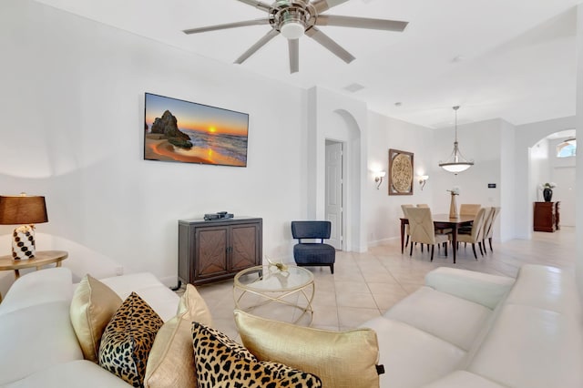 living room with ceiling fan and light tile patterned floors