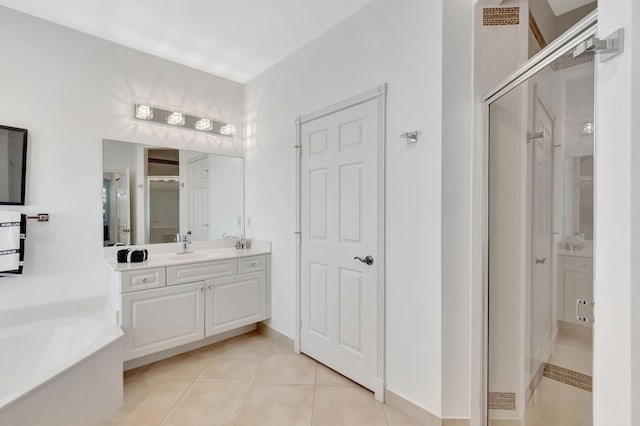 bathroom featuring tile patterned flooring, vanity, and independent shower and bath