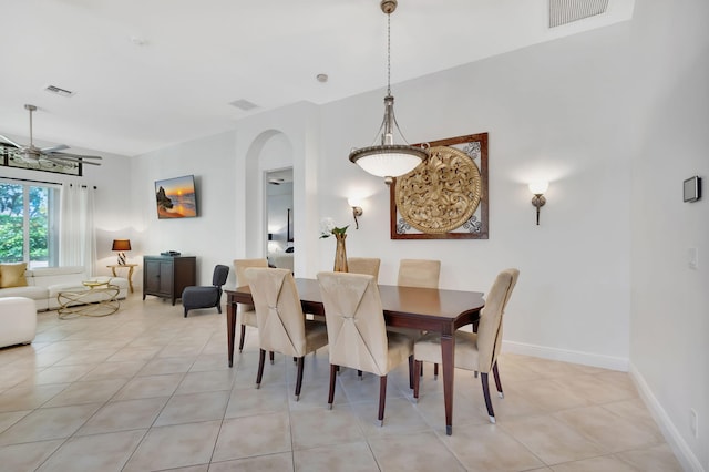 tiled dining room with ceiling fan