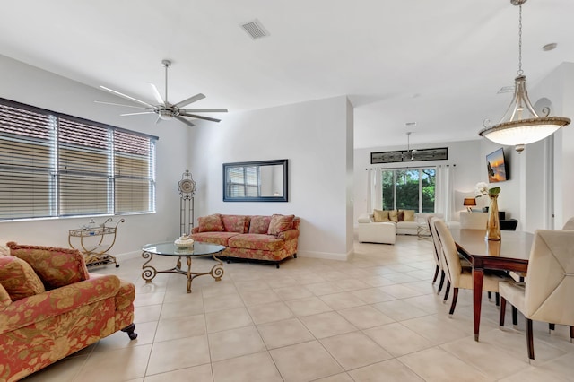 living room featuring light tile patterned floors and ceiling fan