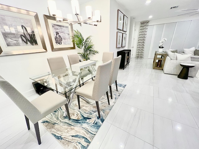 dining space with an inviting chandelier