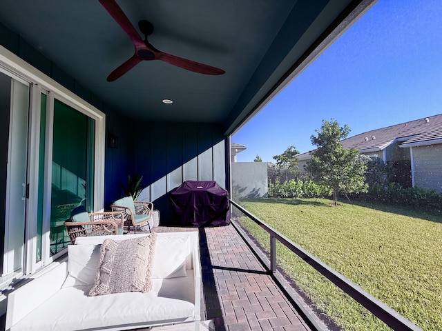 balcony with area for grilling and ceiling fan