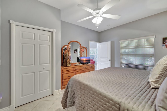 bedroom featuring a ceiling fan and light tile patterned flooring