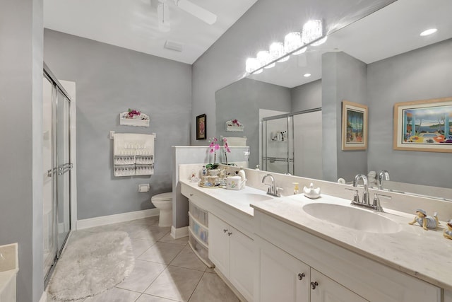 bathroom featuring double vanity, tile patterned flooring, a sink, and a shower stall