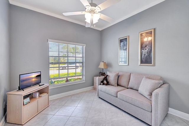 living area with ornamental molding, a ceiling fan, baseboards, and light tile patterned floors